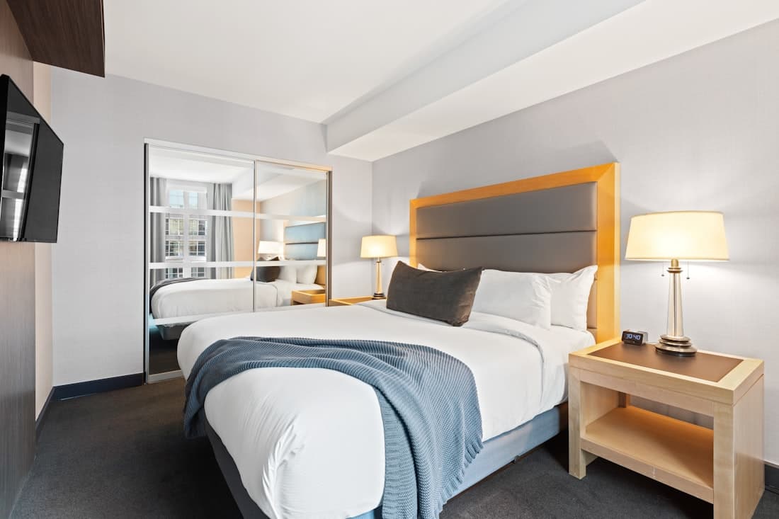 Bright hotel suite with pressed white linen